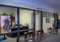 Floor to ceiling windows looking into the Executive Director's office. Floor to ceiling windows looking into the Executive Director's office.